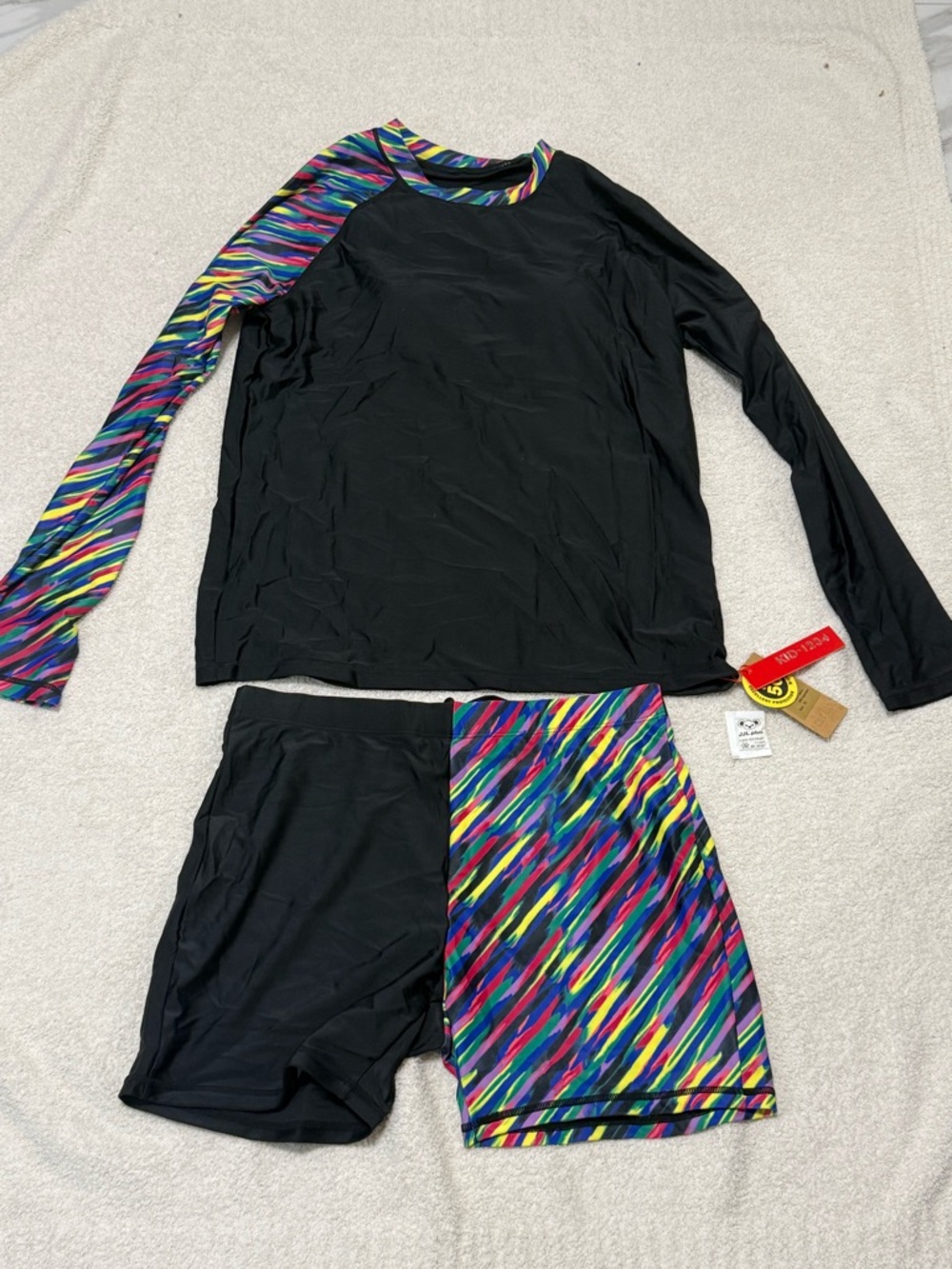 Kids Black Rash Guard Swim Set with Multicolor Stripe Accent
